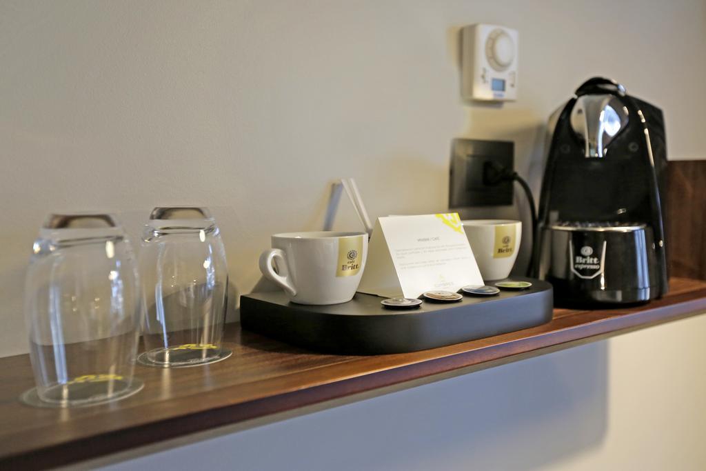 Hotel Cumbres Lastarria Сантьяго Екстер'єр фото A Nespresso coffee machine in a hotel room